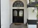 Charming front entrance with a double door and decorative glass, adding curb appeal at 4749 Stoneview Cir, Oldsmar, FL 34677