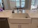 The kitchen is equipped with a farmhouse sink and an elegant faucet at 4749 Stoneview Cir, Oldsmar, FL 34677
