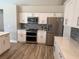 A spacious kitchen with stainless steel appliances and white cabinets at 4749 Stoneview Cir, Oldsmar, FL 34677