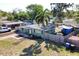 Aerial view of a cozy home with well-kept landscaping, fenced yard and a driveway at 7226 13Th N St, St Petersburg, FL 33702