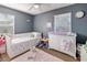 Cozy bedroom with a bed, dresser, and a changing table, perfect for a room at 7226 13Th N St, St Petersburg, FL 33702