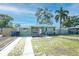 Inviting single-story home with a well-maintained front lawn, driveway, and charming curb appeal at 7226 13Th N St, St Petersburg, FL 33702