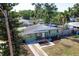 Charming single-story home featuring a well-maintained lawn, mature trees, and inviting curb appeal at 7226 13Th N St, St Petersburg, FL 33702