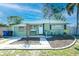 Inviting single-story home with a cozy front porch and neatly landscaped yard at 7226 13Th N St, St Petersburg, FL 33702
