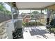 Enclosed sunroom with a toy kitchen, a bar table with stools, and outdoor views at 7226 13Th N St, St Petersburg, FL 33702