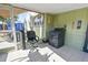 Cozy sunroom offering a black office chair and a dark covered washer at 7226 13Th N St, St Petersburg, FL 33702
