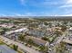 Expansive aerial view of a real estate building and parking with city views on the horizon at 2353 Shelley St # 21, Clearwater, FL 33765
