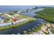 Scenic aerial view of condos near the waterfront and marina in a vibrant community at 603 Bahia Beach Blvd, Ruskin, FL 33570