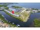 Scenic aerial view of condos near the waterfront and marina in a vibrant community at 603 Bahia Beach Blvd, Ruskin, FL 33570