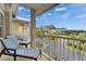 A cozy balcony furnished with cushioned chairs offers views of the neighborhood at 603 Bahia Beach Blvd, Ruskin, FL 33570