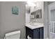 This bathroom offers nautical decor, a modern vanity, and a well-lit mirror, blending style and functionality at 603 Bahia Beach Blvd, Ruskin, FL 33570