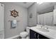 This charming bathroom features nautical decor and a modern vanity with a sink and storage at 603 Bahia Beach Blvd, Ruskin, FL 33570