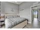 This bedroom features a queen bed with grey bedding, wood flooring, and an anchor decoration at 603 Bahia Beach Blvd, Ruskin, FL 33570
