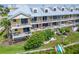 Beautiful condo featuring multiple balconies with outdoor seating and lush green space at 603 Bahia Beach Blvd, Ruskin, FL 33570