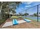 Outdoor game area featuring cornhole and bocce ball courts, perfect for recreation and entertainment at 603 Bahia Beach Blvd, Ruskin, FL 33570