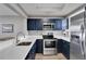 Modern kitchen with stainless steel appliances, sleek countertops, and ample cabinet space, perfect for cooking at 603 Bahia Beach Blvd, Ruskin, FL 33570