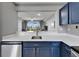 Beautiful kitchen with stainless steel appliances, breakfast bar, and an open view of the living area at 603 Bahia Beach Blvd, Ruskin, FL 33570