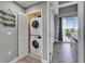 Functional laundry room with a stackable washer and dryer unit for space-saving convenience at 603 Bahia Beach Blvd, Ruskin, FL 33570