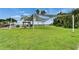 Well-manicured lawn area with shade structures and gazebo, providing a relaxing outdoor space at 603 Bahia Beach Blvd, Ruskin, FL 33570