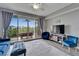 Inviting living room with balcony access, featuring comfortable seating and scenic views at 603 Bahia Beach Blvd, Ruskin, FL 33570