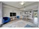 Spacious living room with balcony view, providing a comfortable area for relaxation and entertainment at 603 Bahia Beach Blvd, Ruskin, FL 33570