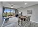 Stylish living room with balcony access, showcasing contemporary decor, ample seating, and natural light at 603 Bahia Beach Blvd, Ruskin, FL 33570