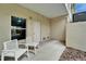 An outdoor patio with seating featuring a pair of white Adirondack chairs at 603 Bahia Beach Blvd, Ruskin, FL 33570
