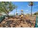 Outdoor playground with a slide and climbing structure for children, set in a shaded area at 603 Bahia Beach Blvd, Ruskin, FL 33570