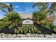 Charming sign for Sunset Bar & Grill surrounded by lush landscaping and inviting atmosphere at 603 Bahia Beach Blvd, Ruskin, FL 33570