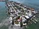 Wide aerial showcases community near waterfront with boat docks and picturesque scenery at 855 Boca Ciega Isle Dr, St Pete Beach, FL 33706