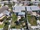 Aerial view of home with pool, outdoor seating area, and lush landscaping in the backyard at 855 Boca Ciega Isle Dr, St Pete Beach, FL 33706