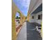Exterior view highlighting covered porch with stone details, arches, and painted concrete at 855 Boca Ciega Isle Dr, St Pete Beach, FL 33706