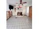 Living room featuring a stone fireplace and tile flooring, awaiting personalized updates at 855 Boca Ciega Isle Dr, St Pete Beach, FL 33706