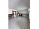 Spacious living room showcasing tile flooring, open layout, and bright natural light from windows at 855 Boca Ciega Isle Dr, St Pete Beach, FL 33706
