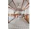 Open living space features tile flooring and unfinished kitchen area, showing renovation potential at 855 Boca Ciega Isle Dr, St Pete Beach, FL 33706