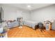 Neutral bedroom featuring parquet floors, ceiling fan, and natural light at 9100 Suffolk Ln, Port Richey, FL 34668