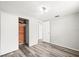 Bedroom with wood flooring and a cedar closet, providing both style and functionality at 9100 Suffolk Ln, Port Richey, FL 34668
