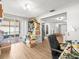 Bonus room with wood-look flooring, shelving, and sliding door access at 9100 Suffolk Ln, Port Richey, FL 34668