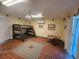 Spacious basement featuring unique tile flooring, a bunk bed, and a comfortable papasan chair at 900 Harbour House Dr, Indian Rocks Beach, FL 33785