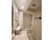 Cozy bathroom featuring a shower-tub combination with white tile and a vanity with a speckled marble-like countertop at 900 Harbour House Dr, Indian Rocks Beach, FL 33785