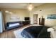 Spacious bedroom with a cozy sitting area, a plush rug and a serene view at 900 Harbour House Dr, Indian Rocks Beach, FL 33785