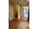 Spacious entryway features unique tile flooring, access to the garage and stairway, offering practicality and style at 900 Harbour House Dr, Indian Rocks Beach, FL 33785