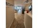 Inviting entryway with tile floors leads to an open living space with a sign reading 