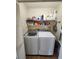 Laundry room with washer and dryer, shelving, and storage space at 900 Harbour House Dr, Indian Rocks Beach, FL 33785