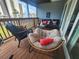 Cozy porch area featuring comfortable seating, vibrant decor, and a relaxed outdoor ambiance at 900 Harbour House Dr, Indian Rocks Beach, FL 33785