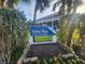 Harbour House Townhomes community sign surrounded by greenery at 900 Harbour House Dr, Indian Rocks Beach, FL 33785