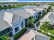 Aerial view of community featuring beautiful landscaping and a pond at 14204 Heritage Landing Blvd # 714, Punta Gorda, FL 33955