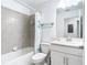 Bathroom featuring a bathtub, a mirror, and a vanity with storage space at 14204 Heritage Landing Blvd # 714, Punta Gorda, FL 33955