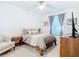The bedroom has gray decor, carpet, and a ceiling fan at 14204 Heritage Landing Blvd # 714, Punta Gorda, FL 33955