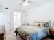 Inviting bedroom features a ceiling fan, gray bedding and carpet flooring at 14204 Heritage Landing Blvd # 714, Punta Gorda, FL 33955